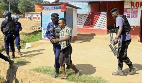 Policemen detain a protester during clashes in Lubumbashi, Democratic Republic of Congo, November 10, 2015. PHOTO BY REUTERS/Kenny Katombe