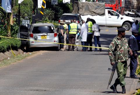 Kenyan policemen and explosives experts gather evidence from the car suspected to have been used by the attackers outside the scene where explosions and gunshots were heard at The DusitD2 complex, in Nairobi, Kenya, January 17, 2019. PHOTO BY REUTERS/Njeri Mwangi