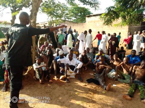 A police officer talks to people who sit on the ground after being freed by police from an Islamic rehabilitation centre in Ibadan, Nigeria in this picture released by Nigeria Police, November 5, 2019. PHOTO BY REUTERS/Nigeria Police