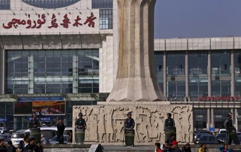 Armed police guard at the entrance of the South Railway Station, where three people were killed and 79 wounded in April 30's bomb and knife attack, in Urumqi, Xinjiang Uighur Autonomous region, May 2, 2014. PHOTO BY  REUTERS/Petar Kujundzic