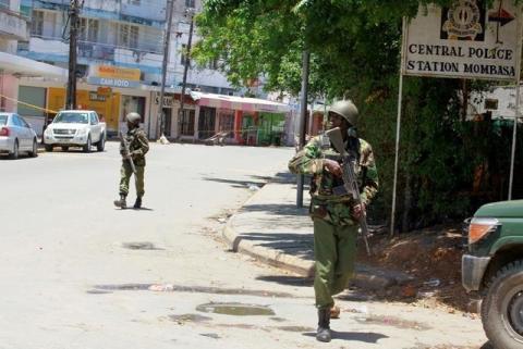 Armed policemen walk outside the central police station after an attack, in the coastal city of Mombasa, Kenya, September 11, 2016. PHOTO BY REUTERS/Joseph Okanga