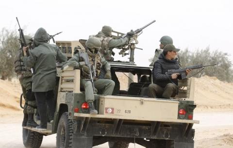 Policemen patrol during a military operation to eliminate militants in a village some 50 km (31 miles) from the town of Ben Guerdane, Tunisia, near the Libyan border, March 10, 2016. PHOTO BY REUTERS/Zoubeir Souissi