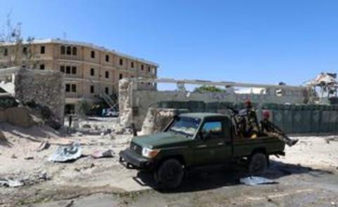 Policemen security forces secure the scene where al-Shabaab militia stormed a government building in Mogadishu, Somalia on March 23, 2019. PHOTO BY REUTERS/Feisal Omar