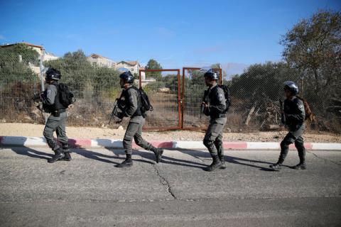 Israeli border policemen patrol at the scene where a police spokeswoman said a Palestinian gunman killed three Israelis guards and wounded a fourth in an attack on a Jewish settlement in the occupied West Bank before himself being shot dead, September 26, 2017. PHOTO BY REUTERS/Ammar Awad