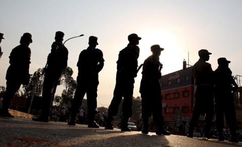 Policemen stand in a line in Kampala, Uganda February 15, 2016. PHOTO BY REUTERS/Goran Tomasevic