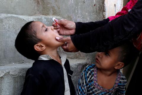 A boy receives polio vaccine drops, during an anti-polio campaign, in a low-income neighbourhood in Karachi, Pakistan, April 9, 2018. PHOTO BY REUTERS/Akhtar Soomro