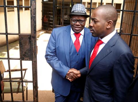 Zimbabwe's former finance minister and opposition Movement for Democratic Change (MDC) politician Tendai Biti is greeted by party leader Nelson Chamisa as he leaves court after being convicted and fined under the country's electoral act in Harare, Zimbabwe, February 18, 2019. PHOTO BY REUTERS/Philimon Bulawayo