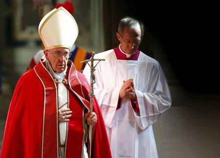 Pope Francis arrives to attend the funeral service for the late Italian Cardinal Roberto Tucci in Saint Peter's Basilica at the Vatican, April 17, 2015. PHOTO BY REUTERS/Tony Gentile