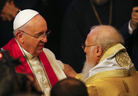 Ecumenical Patriarch Bartholomew I of Constantinople (R) embraces Pope Francis during the Divine Liturgy at the Ecumenical Patriarchate in Istanbul, November 30, 2014. PHOTO BY REUTERS/Umit Bektas