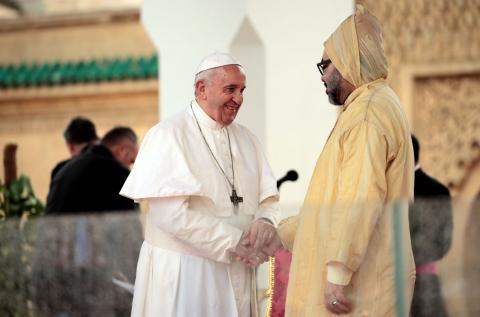 Pope Francis and King Mohammed VI of Morocco shake hands as they visit the Hassan Tower esplanade in Rabat, Morocco, March 30, 2019. PHOTO BY REUTERS/Youssef Boudlal