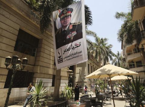 A poster of Abdel Fattah al-Sisi hangs outside the stock exchange in Cairo