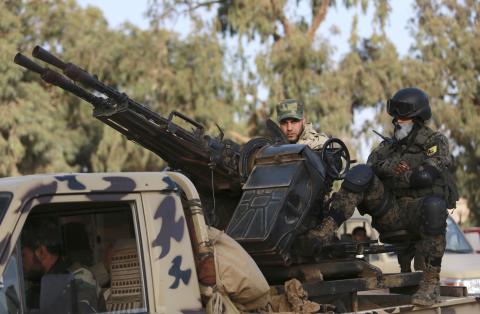 Members of Libyan pro-government forces, which is backed by the locals, look on in an army camp, in Benghazi, February 1, 2015. PHOTO BY REUTERS/Esam Omran Al-Fetori