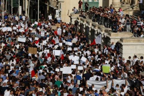 People protest against the assassination of investigative journalist Daphne Caruana Galizia last Monday, in Valletta, Malta, October 22, 2017. PHOTO BY REUTERS/Darrin Zammit Lupi