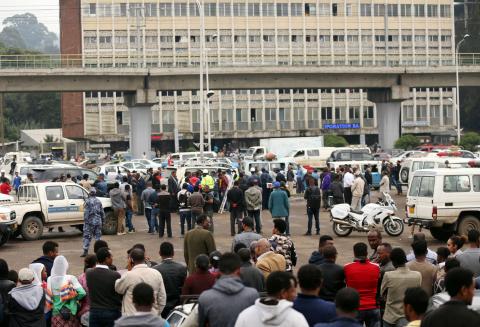 Bystanders watch the scene where EthiopiaÕs Grand Renaissance Dam Project Manager Simegnew Bekele was found dead in his car in Addis Ababa, Ethiopia, July, 26, 2018. PHOTO BY REUTERS/Tiksa Negeri