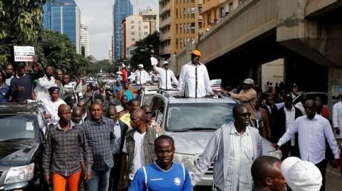 Kenyan opposition leader of the Coalition for Reforms and Democracy (CORD), Raila Odinga leads his supporters during a protest near the premises hosting the headquarters of Independent Electoral and Boundaries Commission (IEBC) to demand the disbandment of the electoral body ahead of next year's election in Nairobi, Kenya, May 23, 2016. PHOTO BY REUTERS/Thomas Mukoya