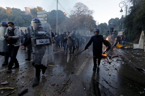 Anti-riot police officers clash with people protesting against President Abdelaziz Bouteflika's plan to extend his 20-year rule by seeking a fifth term in April elections in Algiers, Algeria, March 1, 2019. PHOTO BY REUTERS/Zohra Bensemra