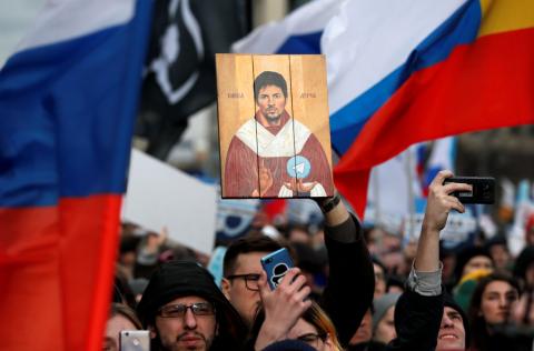 A man holds a picture of Pavel Durov, the founder of Telegram Messenger, during a rally to protest against tightening state control over internet in Moscow, Russia, March 10, 2019. PHOTO BY REUTERS/Shamil Zhumatov