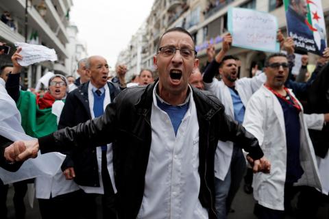 Health workers shout slogans as they march during a protest calling on President Abdelaziz Bouteflika to quit, in Algiers, Algeria, March 19, 2019. PHOTO BY REUTERS/Zohra Bensemra