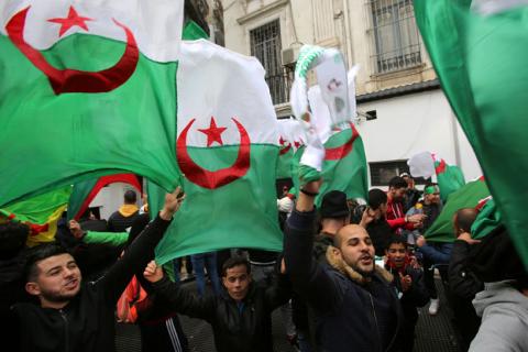 People wave Algerian national flags during a protest calling on President Abdelaziz Bouteflika to quit, in Algiers, Algeria, March 22, 2019. PHOTO BY REUTERS/Ramzi Boudina