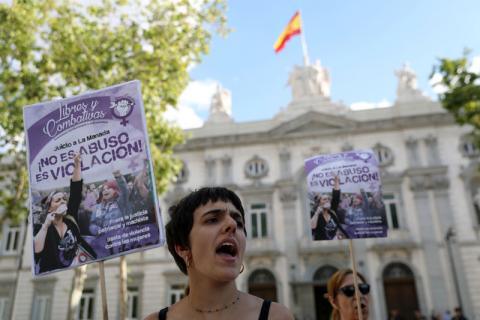 Women gather outside the Supreme Court after Spain's top court found five men known as the "Wolf Pack" guilty of rape in Madrid, Spain, June 21, 2019. The banner reads: It's not abuse, it's rape. PHOTO BY REUTERS/Susana Vera