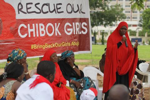 A member of the #BringBackOurGirls Abuja campaign group addresses a sit-in protest at the Unity Fountain in Abuja