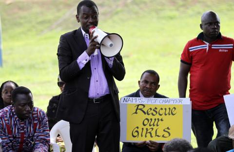 A protester addresses a sit-in rally in support of the release of the abducted Chibok schoolgirls, at the Unity Fountain in Abuja