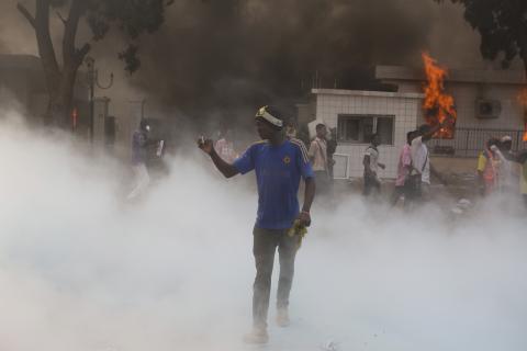 An anti-government protester films events with his cell phone outside the parliament building in Ouagadougou, capital of Burkina Faso, October 30, 2014. PHOTO BY  REUTERS/Joe Penney