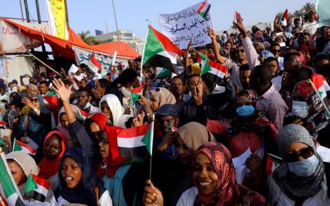 Protesters holding national flags shout slogans during a demonstration in front of the Defence Ministry in Khartoum, Sudan, April 22, 2019. PHOTO BY REUTERS/Umit Bektas