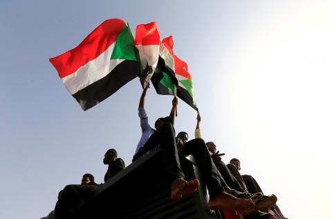 Sudanese protesters shout slogans and wave flags during a rally honouring fallen protesters at the Green Square in Khartoum, Sudan, July 18, 2019. PHOTO BY REUTERS/Mohamed Nureldin Abdallah