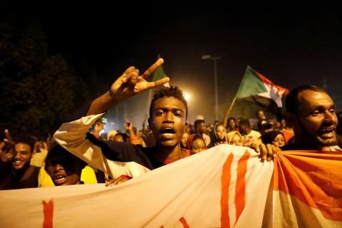 Sudanese people, seeking to revive a push for civilian rule in ongoing tumult since the overthrow of former President Omar al-Bashir more than two months ago, chant slogans and wave Sudanese flags during a demonstration in Khartoum, Sudan, June 21, 2019. PHOTO BY REUTERS/Umit Bektas