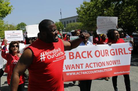 Protesters march in support of the girls kidnapped by members of Boko Haram in front of the Nigerian Embassy in Washington