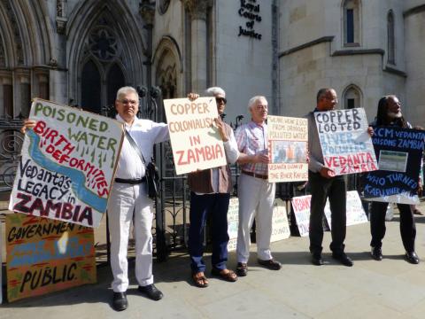 Protesters hold plaques outside the Royal Courts of Justice in London, Britain, July 5, 2017. PHOTO BY REUTERS/Barbara Lewis