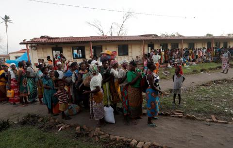 People, moved from school where they were taking refuge, queue to settle at a camp for people displaced in the aftermath of Cyclone Idai in Beira, Mozambique, March 30, 2019. PHOTO BY REUTERS/Zohra Bensemra