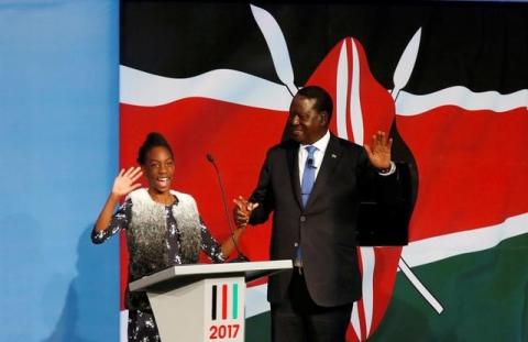 Kenyan opposition leader Raila Odinga, the presidential candidate of the National Super Alliance (NASA) coalition, escorted by his granddaughter, arrives for a Presidential Debate ahead of a general election in Nairobi, Kenya, July 24, 2017. PHOTO BY REUTERS/Thomas Mukoya