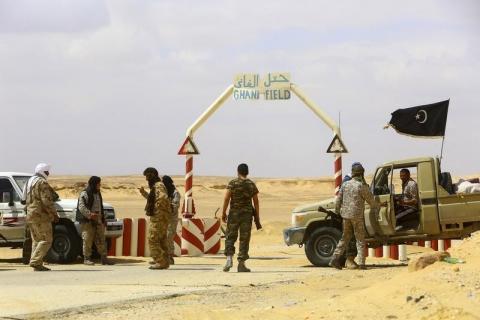 Rebels under Libyan rebel leader Ibrahim Jathran guard the entrance of the al-Ghani oil field, which is currently under the group's control, south of Ras Lanuf, March 18, 2014. PHOTO BY REUTERS/Stringer