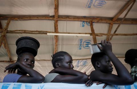 South Sudanese refugees wait in line for food in Omugo refugee settlement camp in northern Uganda, August 23, 2017. PHOTO BY REUTERS/Goran Tomasevic