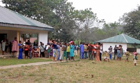 A still image taken from a video shot on December 9, 2017 shows Cameroonian refugees standing outside a center in Agbokim Waterfalls village, which borders on Cameroon, Nigeria. PHOTO BY REUTERS