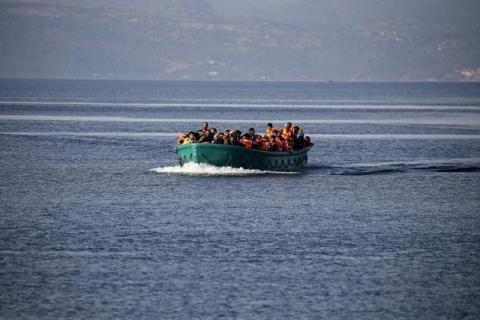 Refugees and migrants arrive on an overcrowded boat on the Greek island of Lesbos, November 10, 2015. PHOTO BY REUTERS/Alkis Konstantinidis