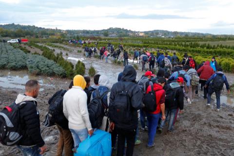 Migrants make their way after crossing the border at Zakany, Hungary, October 16, 2015. PHOTO BY REUTERS/Laszlo Balogh