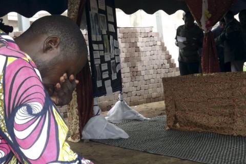 A relative of a victim reacts during a ceremony honouring people killed in protests against a referendum changing the constitution to eliminate presidential term limits in Brazzaville, Congo, October 30, 2015. PHOTO BY REUTERS/Roch Bouka