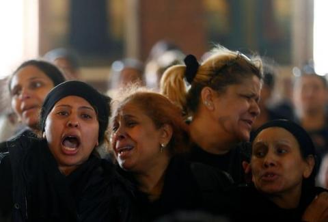 Relatives mourn the victims of the Palm Sunday bombings during the funeral at the Monastery of Saint Mina "Deir Mar Mina" in Alexandria, Egypt, April 10, 2017. PHOTO BY REUTERS/Amr Abdallah Dalsh