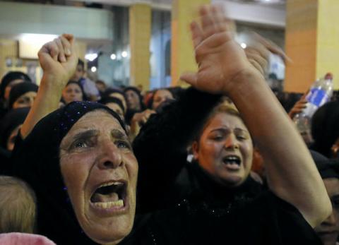 Relatives of victims of an attack that killed at least 28 Coptic Christians on Friday react at the funeral in Minya, Egypt, May 26, 2017. PHOTO BY REUTERS/Mohamed Abd El Ghany