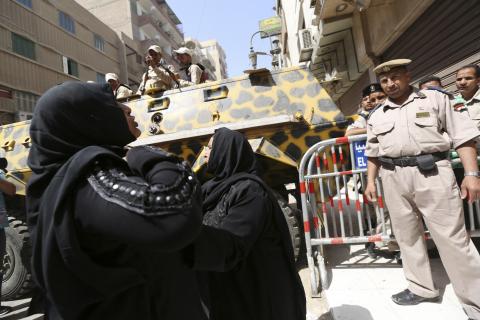 Relatives and families of members of Muslim Brotherhood and supporters of ousted President Mohamed Mursi react in front of the court in Minya, south of Cairo, after hearing the sentence handed to Muslim Brotherhood leader Mohamed Badie and other Brotherhood supporters