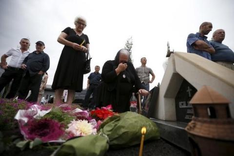 Relatives of the Georgian soldiers killed during Georgia's war conflict with Russia over the breakaway region of South Ossetia in 2008 mourn during a ceremony at the memorial cemetery in Tbilisi, Georgia, August 8, 2015. PHOTO BY REUTERS/David Mdzinarishvili