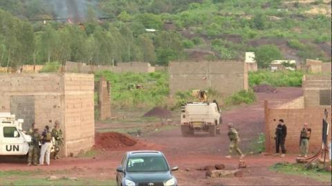 An armoured vehicle drives towards Le Campement Kangaba resort following an attack where gunmen stormed the resort in Dougourakoro, to the east of the capital Bamako, Mali in this still frame taken from video, June 18, 2017. PHOTO BY REUTERS