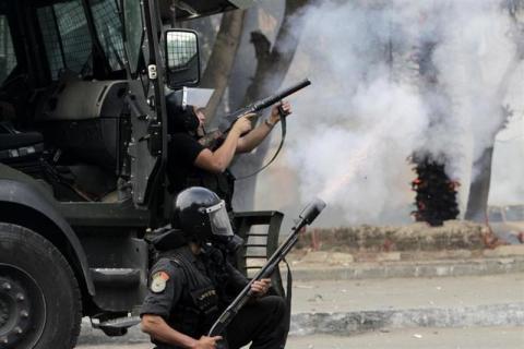 Riot police clash with supporters of the Muslim Brotherhood and ousted Egyptian President Mursi around the Qubba Palace in Cairo