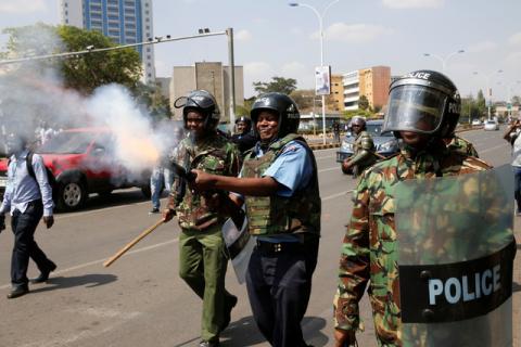 A Kenyan riot policemen fires tear gas to disperse supporters of the opposition National Super Alliance (NASA) coalition during a demonstration calling for the removal of Independent Electoral and Boundaries Commission (IEBC) officials in Nairobi, Kenya, September 26, 2017. PHOTO BY REUTERS/Baz Ratner