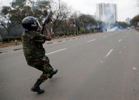 A riot policeman fires tear gas to disperse supporters of Kenyan opposition National Super Alliance (NASA) coalition, during a protest along a street in Nairobi, Kenya, October 13, 2017. PHOTO BY REUTERS/Thomas Mukoya