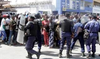 Riot police hold their position as they attempt to disperse supporters of Democratic Republic of Congo's opposition Presidential candidate Moise Katumbi as they escort him to the prosecutor's office over government allegations he hired mercenaries in a plot against the state in Lubumbashi, the capital of Katanga province, May 13, 2016. PHOTO BY REUTERS/Kenny Katombe