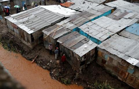 A general view shows the Nairobi river flowing through the Huruma neighbourhood after a six-storey building collapse after days of heavy rain in Nairobi, Kenya, May 1, 2016. PHOTO BY REUTERS/Thomas Mukoya